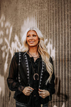 Load image into Gallery viewer, Add a touch of grounded charm to your wardrobe with this vintage-inspired horseshoe necklace. Its detailed antique finish and long, easy-layering chain make it the ultimate Western accent for any outfit.
