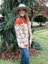 Load image into Gallery viewer, Rust plaid shacket oversized with button front closure 
