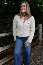 Load image into Gallery viewer, cream color button front sweater top with lace around the cuffs and neckline. It is also the perfect V-neck transition sweater going into fall 
