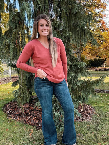 V neck sweater with front seam long sleeve paired with denim jeans 