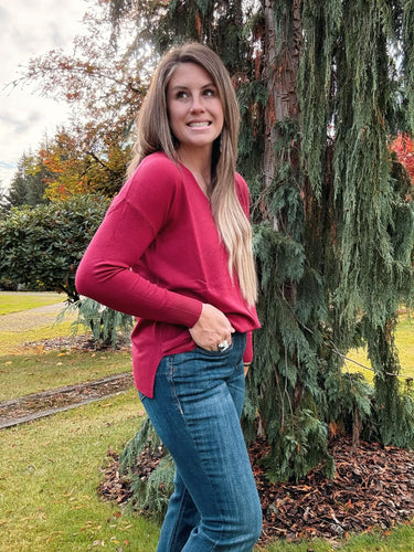 V neck front seam sweater paired with denim jeans 