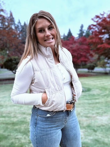 Reversible corduroy puffer vest with zipper closure 