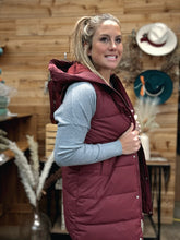 Load image into Gallery viewer, the most cozy hooded puffer vest long style with zipper front. water resistant and wind resistant. 
